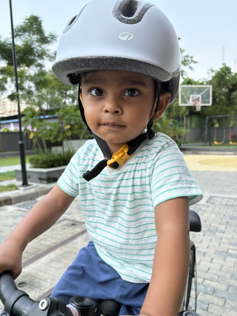 Close-up portrait of Satyartha wearing a bicycle helmet