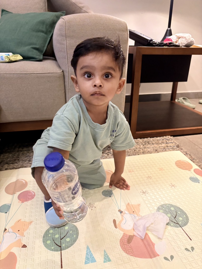 Satyartha holding a water bottle